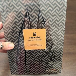 NIB sonic electric toothbrush sealed in box I don’t know the color